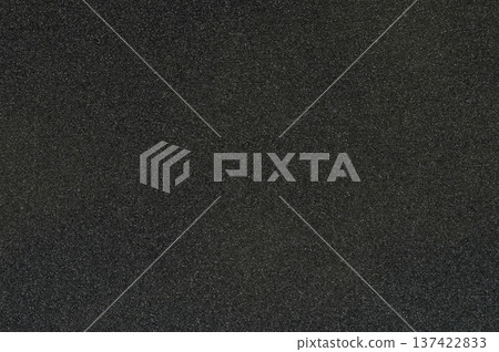Black sandpaper texture with rough surface showing fine grain details clearly Black sandpaper texture with rough surface showing fine grain details clearly 137422833