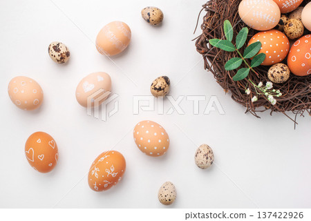 Easter nest with hand-painted eggs on a light background Easter nest with hand-painted eggs on a light background 137422926