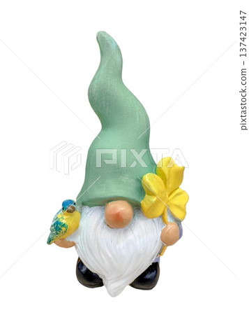 Gnome figurine with green hat and beard holding clover and bird, isolated on transparent background, cute decor for ads. Gnome figurine with green hat and beard holding clover and bird, isolated on transparent background, cute decor for ads. 137423147