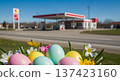 Easter eggs flowers by roadside gasstation, spring pastel travel holiday scene with copyspace for seasonal service ads 137423160