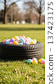 Tire Easter eggs grass spring pastel auto service holiday outdoors display in park, seasonal car care promotion concepts 137423175
