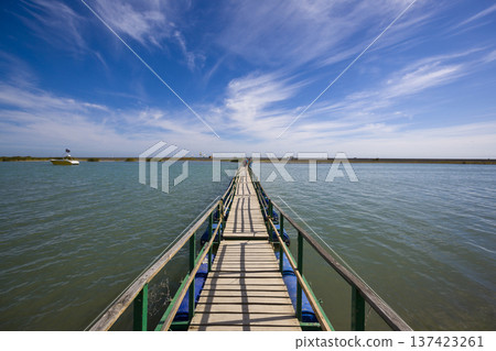 Journey Across Water Toward Distant Horizon Under Sky Journey Across Water Toward Distant Horizon Under Sky 137423261