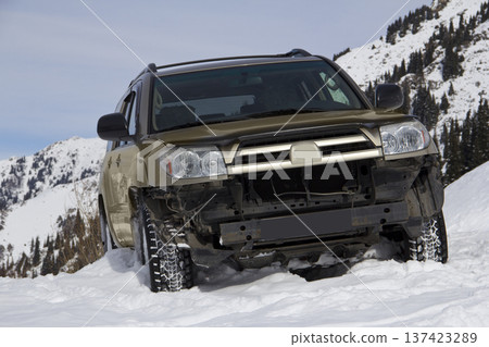 Off-Road SUV Buried in Deep Mountain Snow During Winter Expedition Off-Road SUV Buried in Deep Mountain Snow During Winter Expedition 137423289