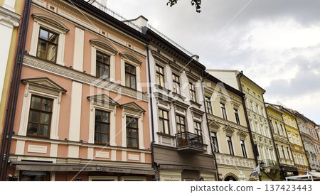 View of historic city architecture feature traditional residential building. Facades display classic design elements, detailed windows and textured walls, capturing cultural heritage urban environment 137423443