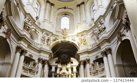 Interior view of a beautiful church showcasing ornate architecture, high ceilings and detailed decorations. Sacred space emphasizing the atmosphere of peace, spirituality and historical character 137423444