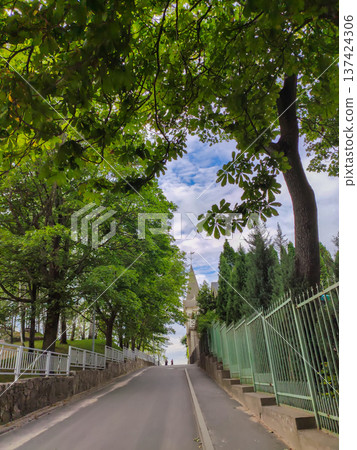 A summer street scene in Jurmala. Bright sunny mood and resort town energy. A summer street scene in Jurmala. Bright sunny mood and resort town energy. 137424306