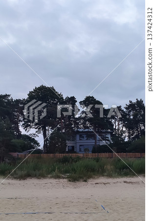 A street in Jurmala in summer. Light summer breeze and coastal town rhythm. A street in Jurmala in summer. Light summer breeze and coastal town rhythm. 137424312