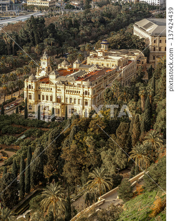 Aerial View Of Historic Malaga Town hall Building Surrounded By Palm Trees And Lush City Park 137424439
