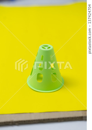 Green Plastic Net Pot Hydroponic Cone on Vibrant Yellow Background Green Plastic Net Pot Hydroponic Cone on Vibrant Yellow Background 137424704