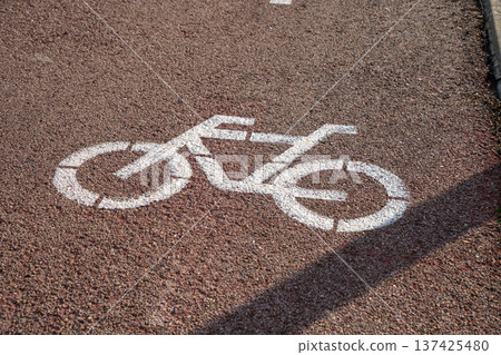 Image in the asphalt of a road with bike lane 137425480