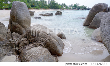 Granite Rocks Scattered Across Shallow Tropical Seawater 137426365