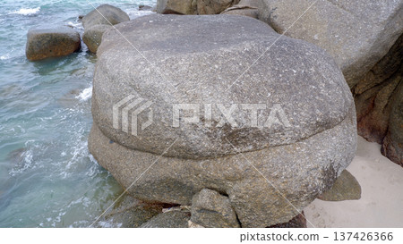 Large Granite Boulder On Tropical Beach Shoreline 137426366