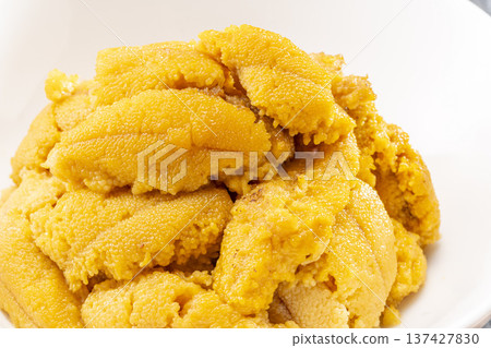 A pile of fresh raw sea urchin on a white plate from Shakotan, Hokkaido 137427830