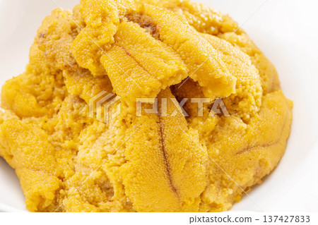 A pile of fresh raw sea urchin on a white plate from Shakotan, Hokkaido A pile of fresh raw sea urchin on a white plate from Shakotan, Hokkaido 137427833