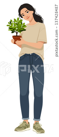 Woman holding small green potted plant 137428487