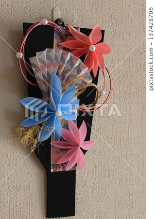 An indoor decoration made in the shape of a battledore An indoor decoration made in the shape of a battledore 137428706