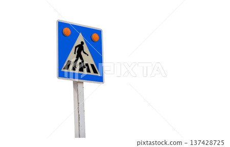 A white metal pedestrian crossing sign isolated from the background Pedestrian Crossing Sign Isolated royalty 137428725