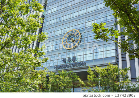 A view of the Hakata Station clock and glass architecture 137428902