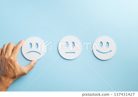 Bad customer negative feedback survey with hand selecting unhappy emoji icon, symbolizing poor service experience, business complaint, and low satisfaction rating for improvement Bad customer negative feedback survey with hand selecting unhappy emoji icon, symbolizing poor service experience, business complaint, and low satisfaction rating for improvement 137431427
