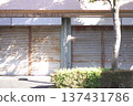 A closed store with its shutters down 137431786