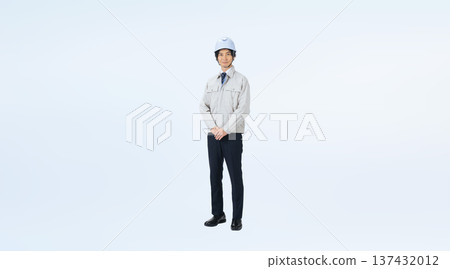 Full-body photo of a man in work clothes wearing a helmet Full-body photo of a man in work clothes wearing a helmet 137432012
