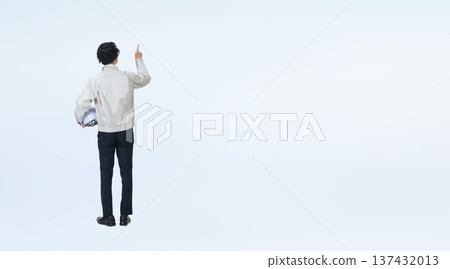 Full-body photo of a man in work clothes inspecting something 137432013
