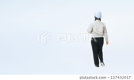 Full-body photo of a woman in work clothes walking from behind Full-body photo of a woman in work clothes walking from behind 137432017