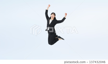 Full-body photo of a female business person in a jumping suit 137432046