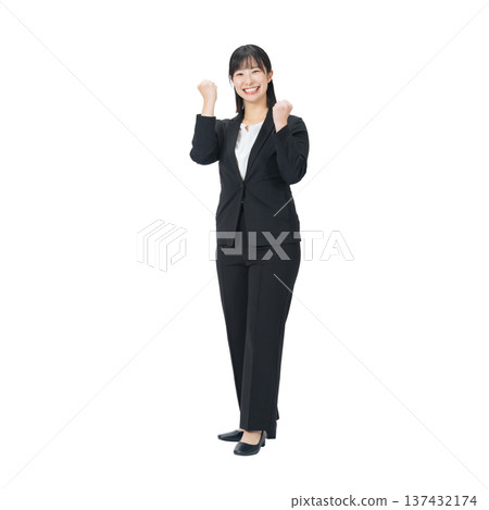 A female business person in a suit making a fist pump. A transparent, hand-cut, full-body PNG photo. 137432174