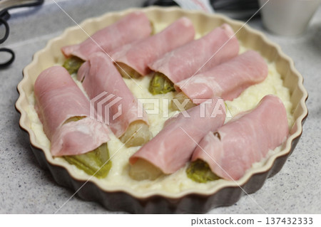 Making Belgian dish Chicon Gratin 137432333
