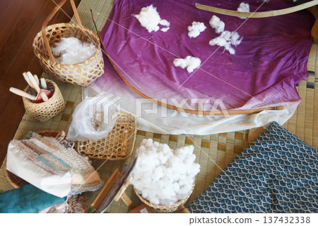 Shooting cotton with a cotton bow Shooting cotton with a cotton bow 137432338