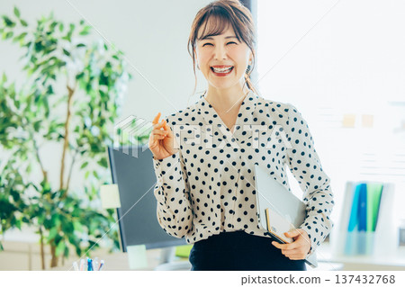 A young woman working in the office A young woman working in the office 137432768