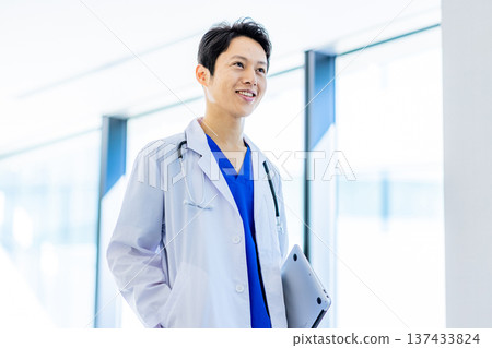 Young doctor working in a hospital 137433824