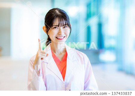 Young female doctor working in a hospital 137433837