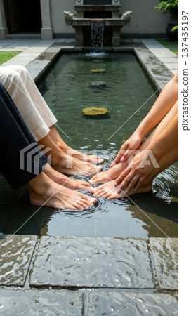 Two people dipping feet in courtyard fountain water Two people dipping feet in courtyard fountain water 137435197