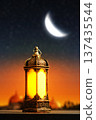 Ramadan Lantern with Crescent Moon and Mosque Silhouette. Islamic Holiday Greeting for Ramadan Kareem and Eid Mubarak. High quality photo Ramadan Lantern with Crescent Moon and Mosque Silhouette. Islamic Holiday Greeting for Ramadan Kareem and Eid Mubarak. High quality photo 137435544