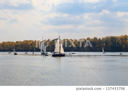 Yachts at sailing regatta on the Dnieper river in Kremenchug, Ukraine Yachts at sailing regatta on the Dnieper river in Kremenchug, Ukraine 137435706