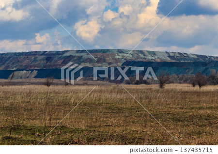View of slag heaps of iron ore quarry. Mining industry View of slag heaps of iron ore quarry. Mining industry 137435715