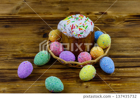 Easter cake and easter eggs on a wooden table Easter cake and easter eggs on a wooden table 137435732
