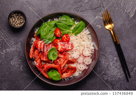 Bowl with vegan fried soy meat and vegetables served with boiled rice. Bowl with vegan fried soy meat and vegetables served with boiled rice. 137436849
