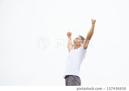 Man pumping his fist in victory 137436938