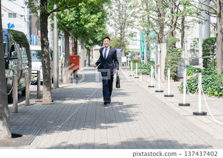 Young male business running Young male business running 137437402