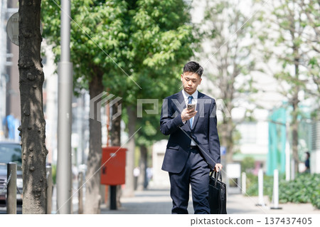 Young male business smartphone 137437405