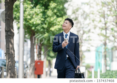 Young male business smartphone Young male business smartphone 137437408