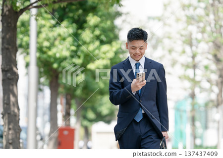 Young male business smartphone Young male business smartphone 137437409