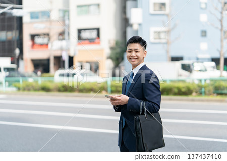 Young male business smartphone Young male business smartphone 137437410