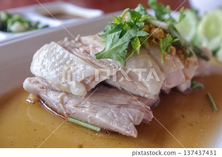 Close up of Singaporean poached chicken garnished 137437431
