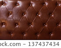 Brown tufted leather texture background with buttons. 137437434