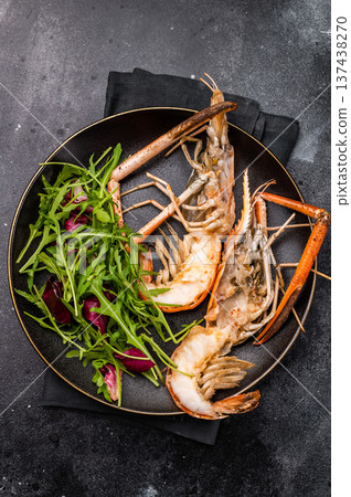 Elegant plate of grilled rosenbergii prawns shrimps garnished with fresh herbs, perfect for gourmet dining experiences. black background. top view Elegant plate of grilled rosenbergii prawns shrimps garnished with fresh herbs, perfect for gourmet dining experiences. black background. top view 137438270