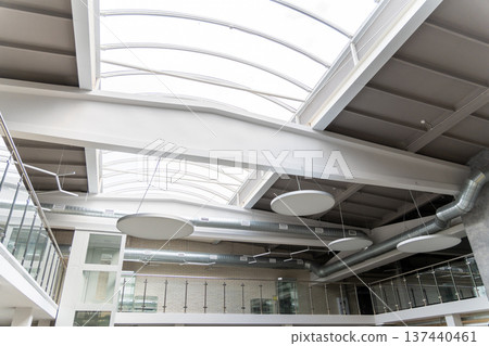 Low angle view of modern interior with large skylights Low angle view of modern interior with large skylights 137440461